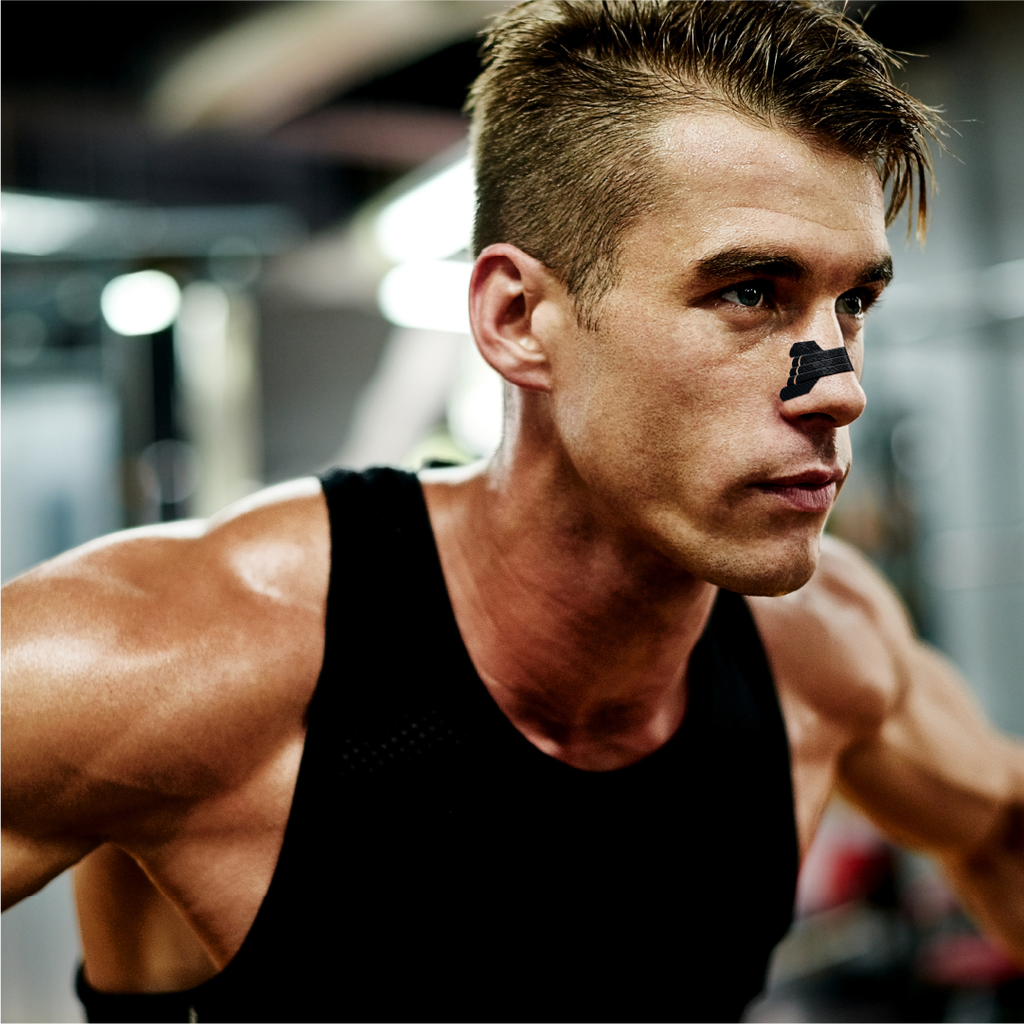 Man wearing clear passage performance nasal strips while working our for enhanced athletic performance