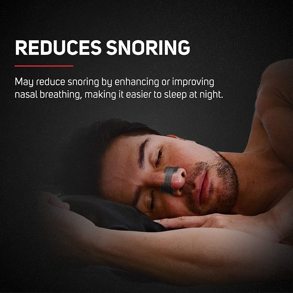 Man sleeping using nasal strip. Reduces snoring, may reduce snoring by enhancing or improving nasal breathing, making it easier to sleep at night.